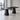 Charcoal black long rectangular table on two tapered block pedestals in the office, full room view