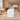 White reception desk with gray L-shaped counter in the same office, side view