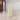 Beige reception desk with circle and semicircle LED recesses in office - side view