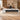 White and charcoal left-return executive desk in an office, front view