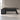 Dark wood executive desk with marble cabinet in an office, front view