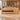 Honey oak reception counter with black recessed panel in an office, front view