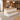 White and honey oak reception desk with integrated visitor bench and two cushions in a furnished check-in office, 45-degree view