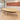 Light wood oval meeting table with beige legs and dark curved apron — closer complete product view in the same office