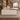 White executive desk with plain left storage return and dark wood trim in a furnished private office, side view