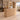 Plain oak curved reception counter in a furnished office with illuminated storage, 45-degree view