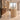 Plain oak curved reception counter in a furnished office with illuminated storage, side view