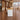 White and maple reception counter with three vertical wood strips in a furnished office, side view