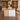 White and maple reception counter with three vertical wood strips in a furnished office, front view