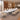 White boat-shaped conference table with a sculpted gray pedestal in a furnished meeting room, 45-degree view