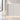 White curved fluted reception counter with a warm LED-lit base, visible surface detail in the same office