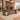 Walnut executive desk with twin storage pedestals and quilted triangular accents in a furnished office, 45-degree view