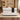 White marble reception counter with black draped accent in a furnished office, front view