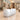 Glossy white barrel-shaped reception counter for two staff in a furnished office, 45-degree view