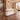 White and light oak rattan reception desk in a furnished corporate office, 45-degree view