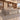 Gray wood and cream L-shaped executive desk with fluted front and side storage in a furnished office, 45-degree view