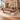 Brown walnut and cream executive desk with right side storage in a furnished office, 45-degree view