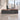 Lurpes red walnut and dark gray executive desk in a limestone office, lower camera view