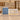 Powder blue and terrazzo reception desk with display niche in a furnished office, front view