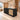 Black reception desk with rattan inset in a furnished office, 45-degree view