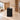 Black reception desk with plain side panel in a furnished office, side view