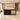 Black reception desk with four rounded panels and rattan inset in a furnished office, front view