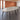 Light gray oval conference table with six black legs and two silver cable covers — closer complete product view in the same office
