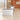 White and gray marble L-shaped reception desk in office - side view