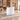 White curved reception desk in the same office, 45-degree view
