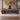 Walnut and charcoal executive desk in office - front view