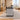 Gray marble reception counter with black top in the same office, side view