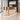 Copper and cream curved reception desk in salon - 45 degree view