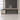 Champagne and graphite executive desk in an office, front view