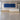 White and light oak straight reception desk in lobby - front view