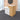 Light wood and white oval reception desk in salon - 45 degree view