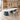 White boat-shaped meeting table with three teal pedestals in the same office, 45-degree view