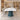 White boat-shaped meeting table with three teal pedestals in the same office, side view
