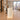 Cream fluted curved reception desk with base lighting in the same office, side view