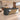 Charcoal reception counter in the same furnished office, 45-degree view